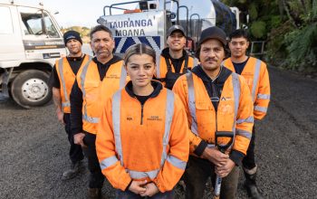 Group of roadworkers from Acon Industries in front of truck